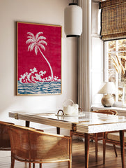 White palm tree and crashing waves illustration on a red background with blue and beige ocean, in a styled room mockup