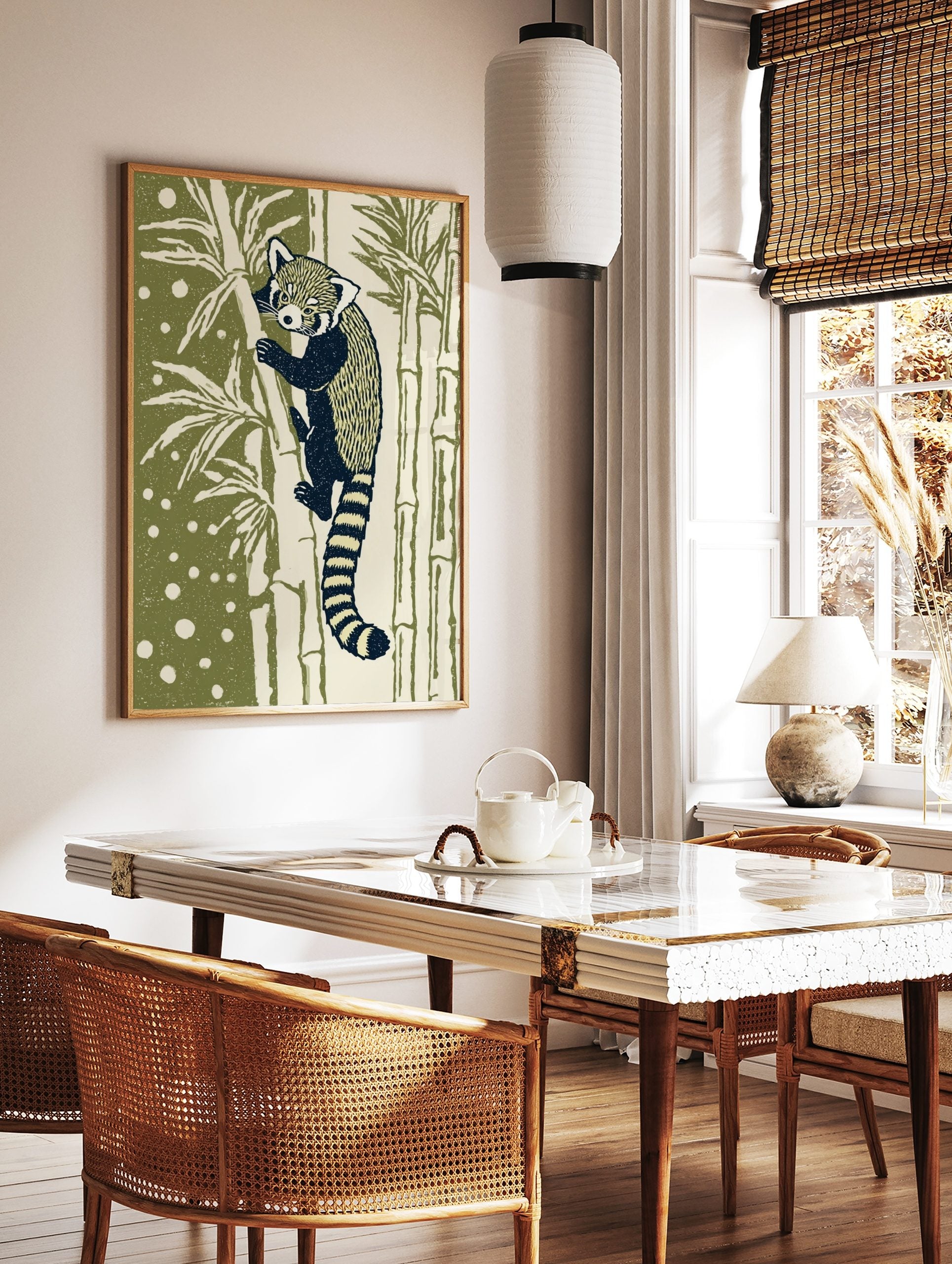 Illustrative red panda climbing bamboo art print with dark navy and cream fur, olive green, in a styled room mockup