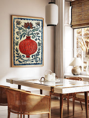 Vibrant red pomegranate poster with a blue border, surrounded by blue and green leaves, flowers, and butterflies on a white background. - Image 2