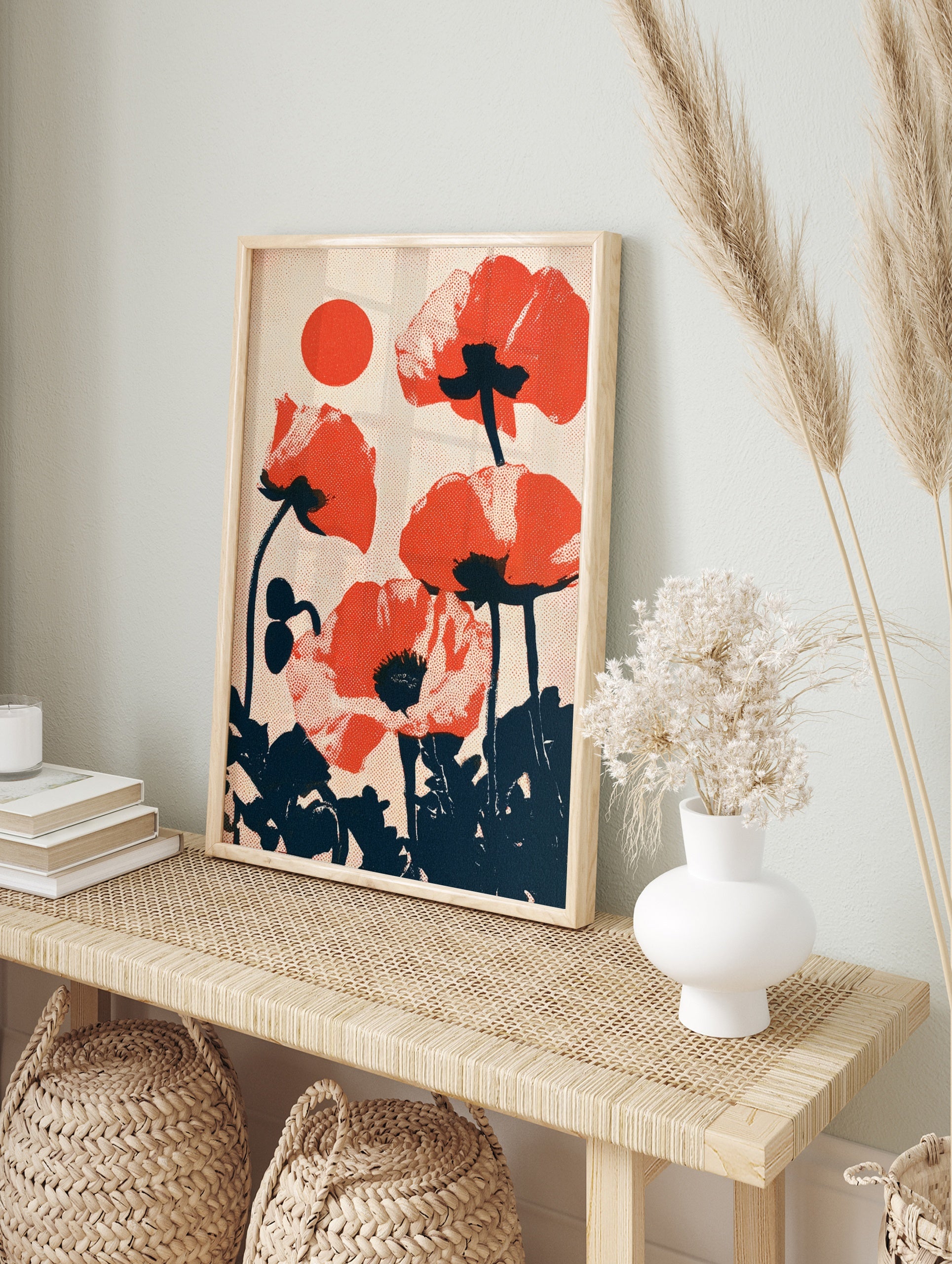 Red poppy flower wall art with a retro halftone dot effect and a circular sun motif on a, in an alternate framed mockup