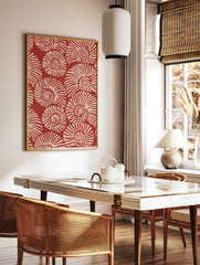 Repeating pattern of white spiralling nautilus shells on a deep red background, illustrative wall, in a styled room mockup