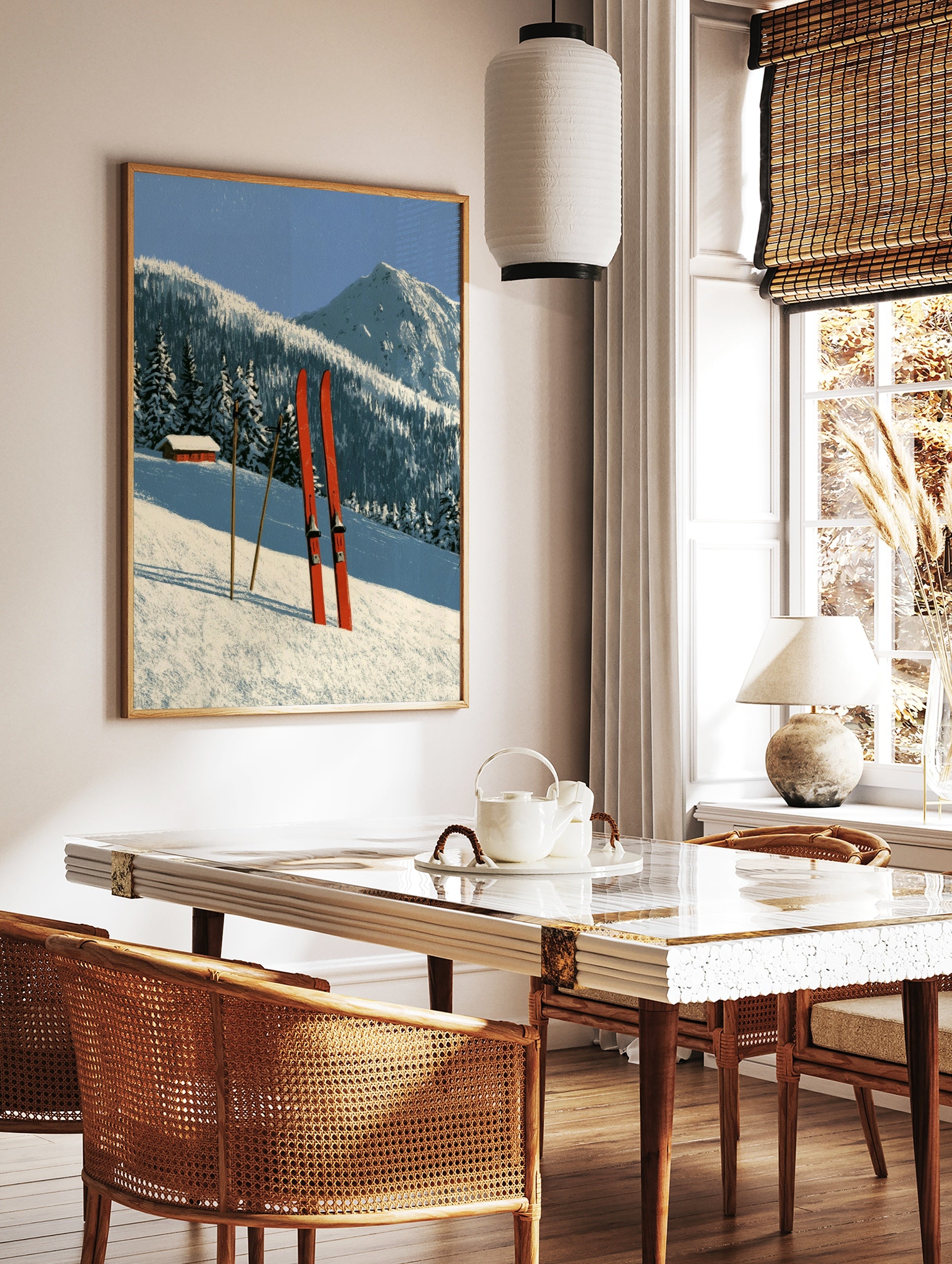 Red skis and poles in deep snow with a mountain cabin and forest background illustration, in a styled room mockup