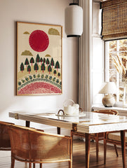 Illustrative red sun and golden clouds over a green forest with decorative patterns on a cream, in a styled room mockup
