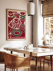 Stylized red and green illustrative art print of a tea cup, hand, record player, and flowers on, in a styled room mockup
