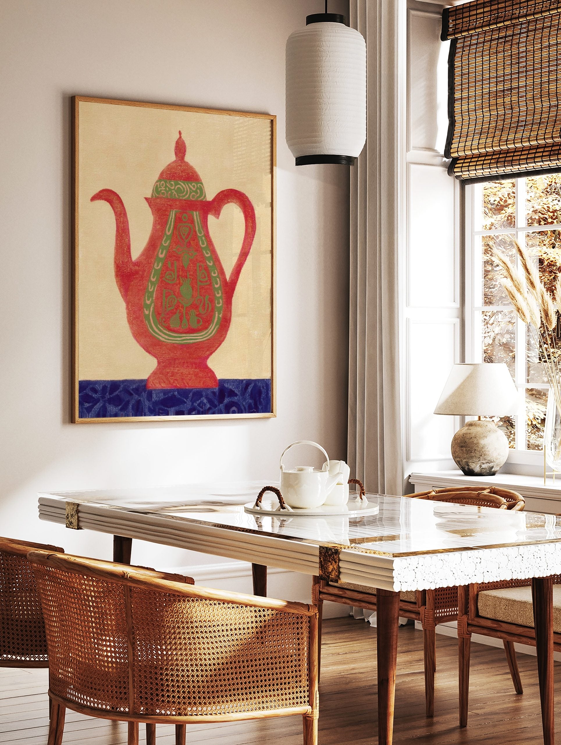 Red teapot wall art with green ornate patterns and a blue decorative base on a beige background, in a styled room mockup