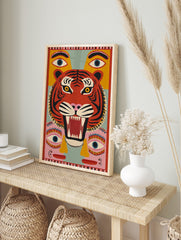 Stylised red tiger face with black stripes, yellow eyes, open mouth, surrounded by floating, in an alternate framed mockup