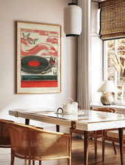 Red turntable with black vinyl record, two flying birds, and red wave patterns in illustrative style, in a styled room mockup