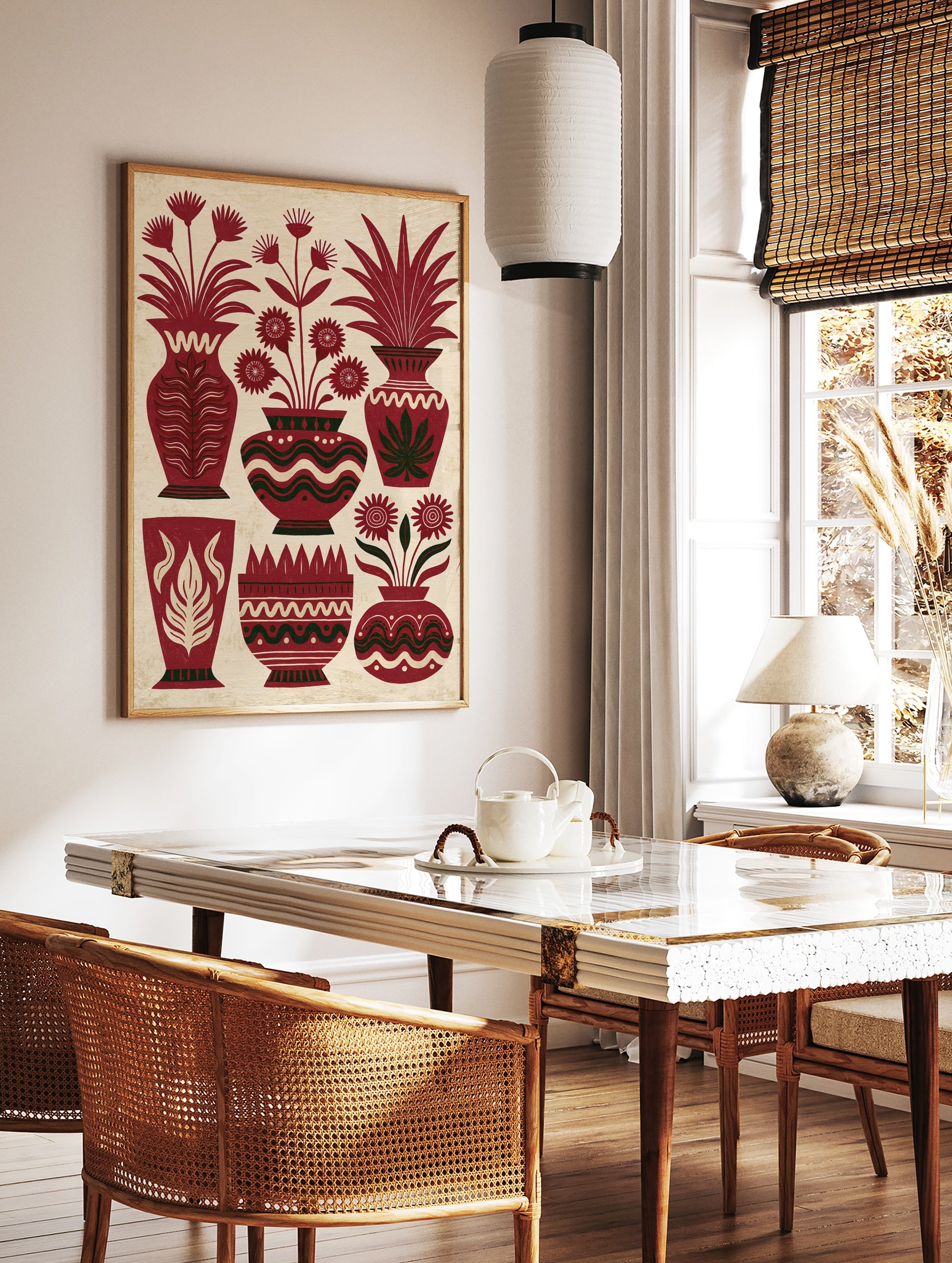 Illustrative red vase wall art with stylized flowers and leafy plants on a textured cream background, in a styled room mockup