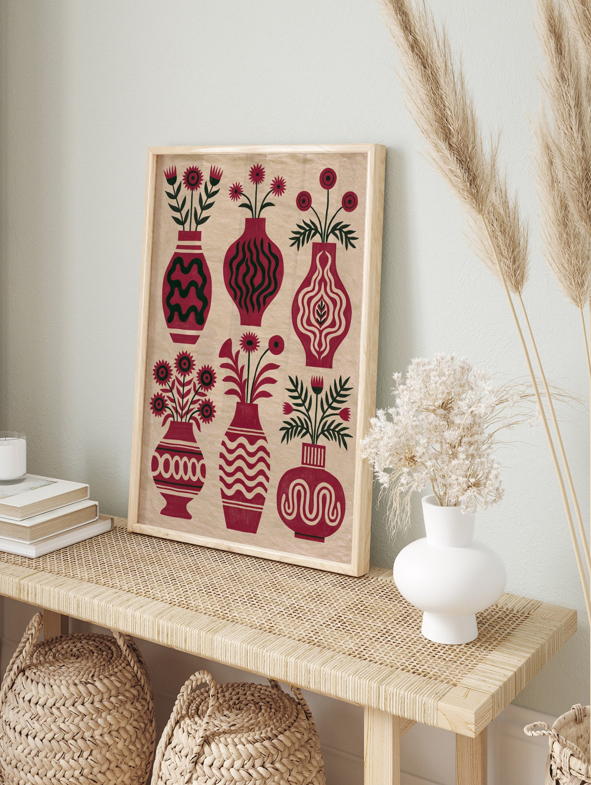 Botanical red vase wall art print with six floral arrangements and dark green foliage on a, in an alternate framed mockup