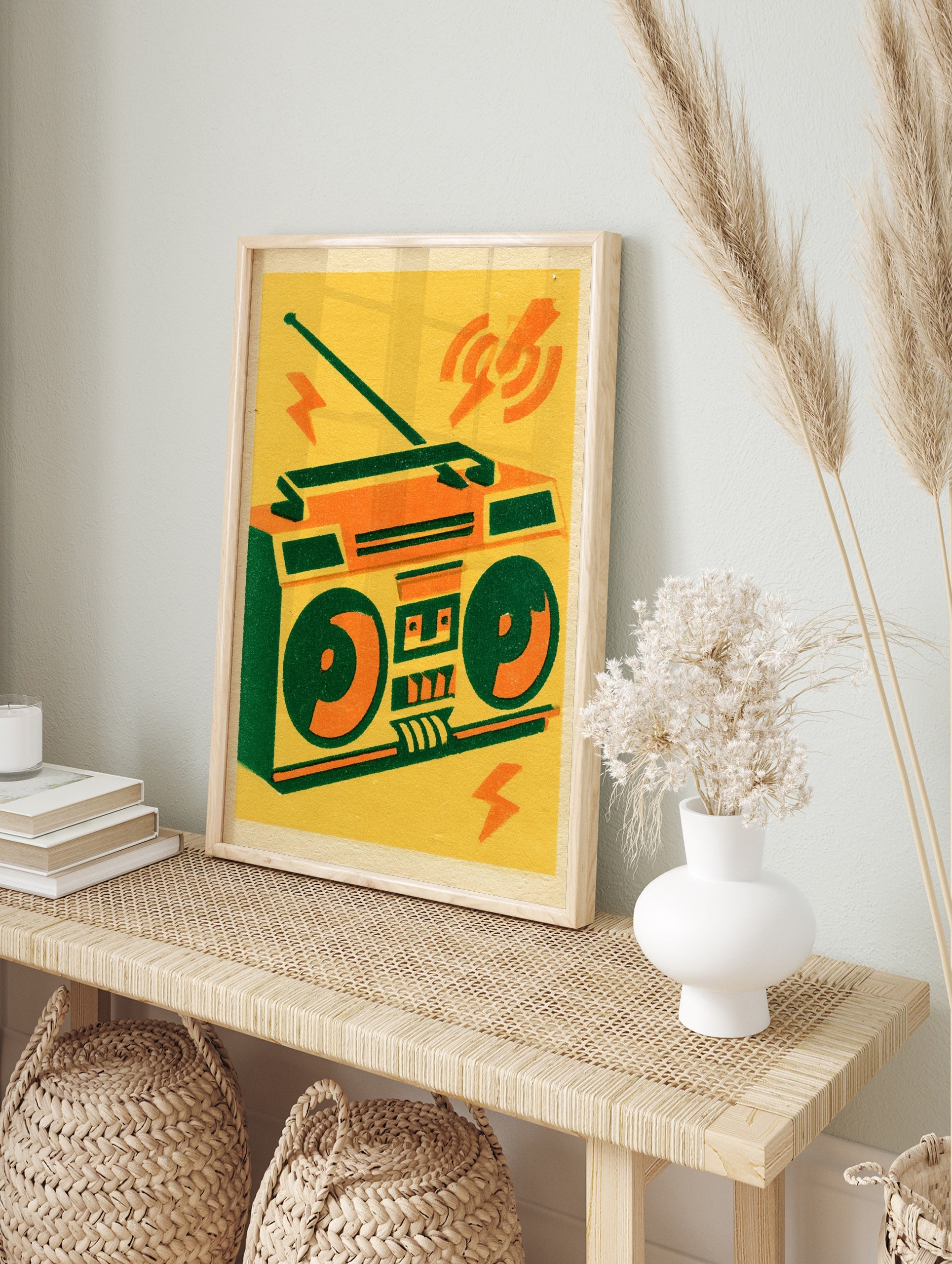 Retro boombox illustration with orange and green details on a yellow background, graphic, in an alternate framed mockup