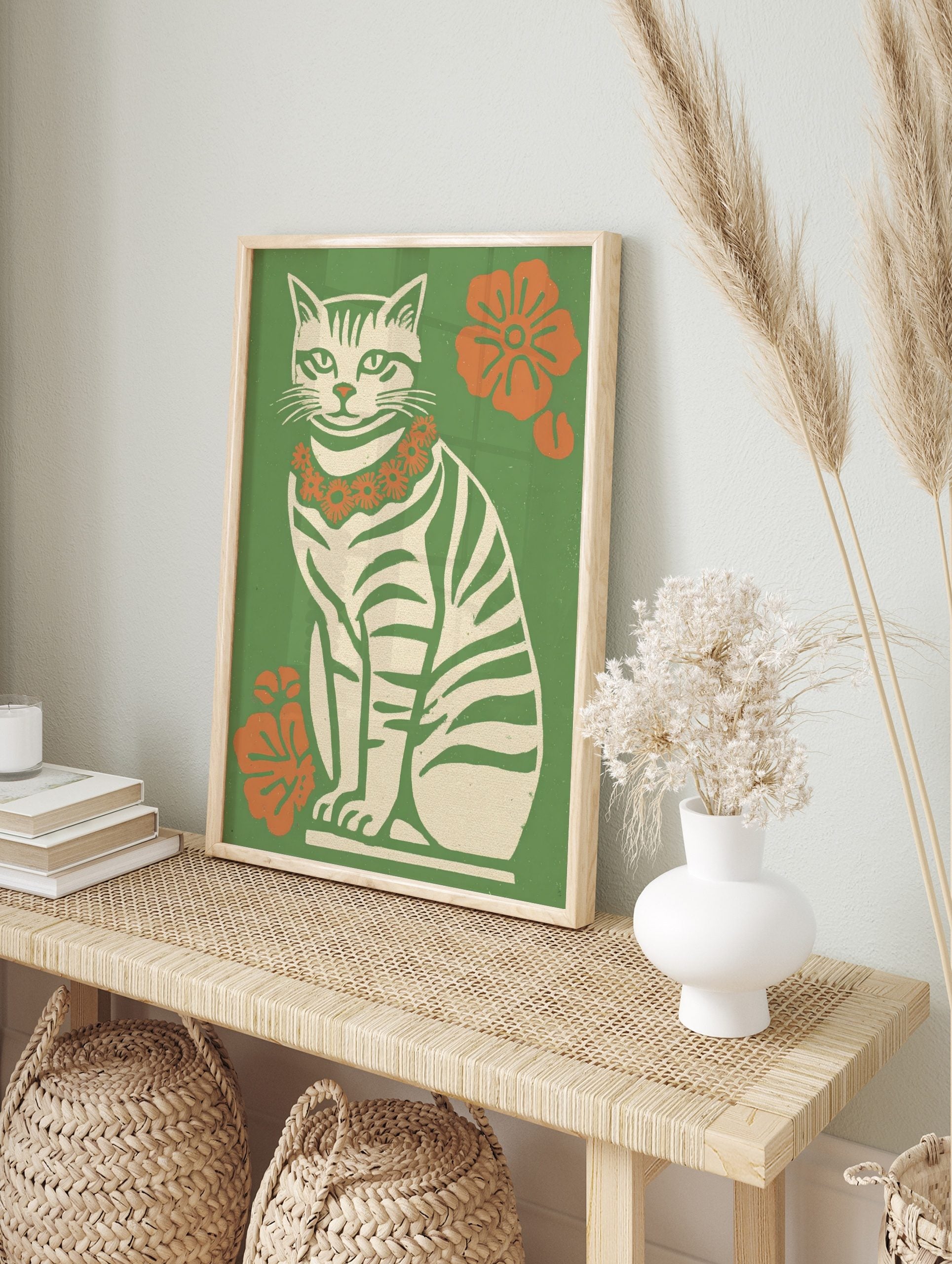 Illustrative retro cat wall art print with green stripes, orange flower lei, and green, in an alternate framed mockup