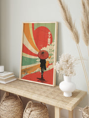 Retro Japanese wall art with person holding red umbrella, red sun, colourful rays, clouds, in an alternate framed mockup