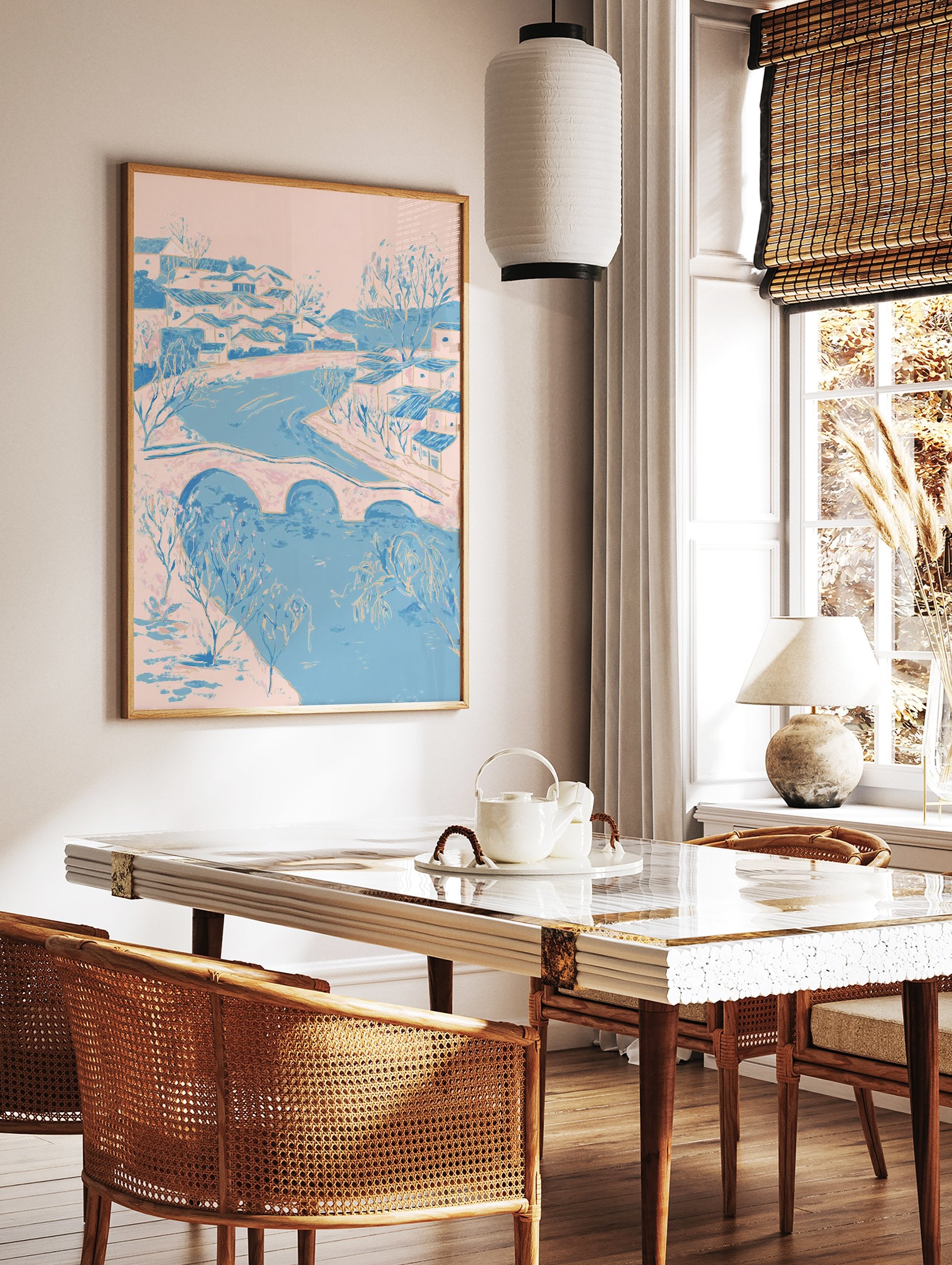 Illustrative riverside village wall art with pink and blue houses, a bridge over a river, and bare trees. - Image 2