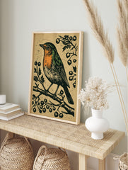 Linocut style art print of a robin bird with orange breast on a berry branch, textured beige, in an alternate framed mockup