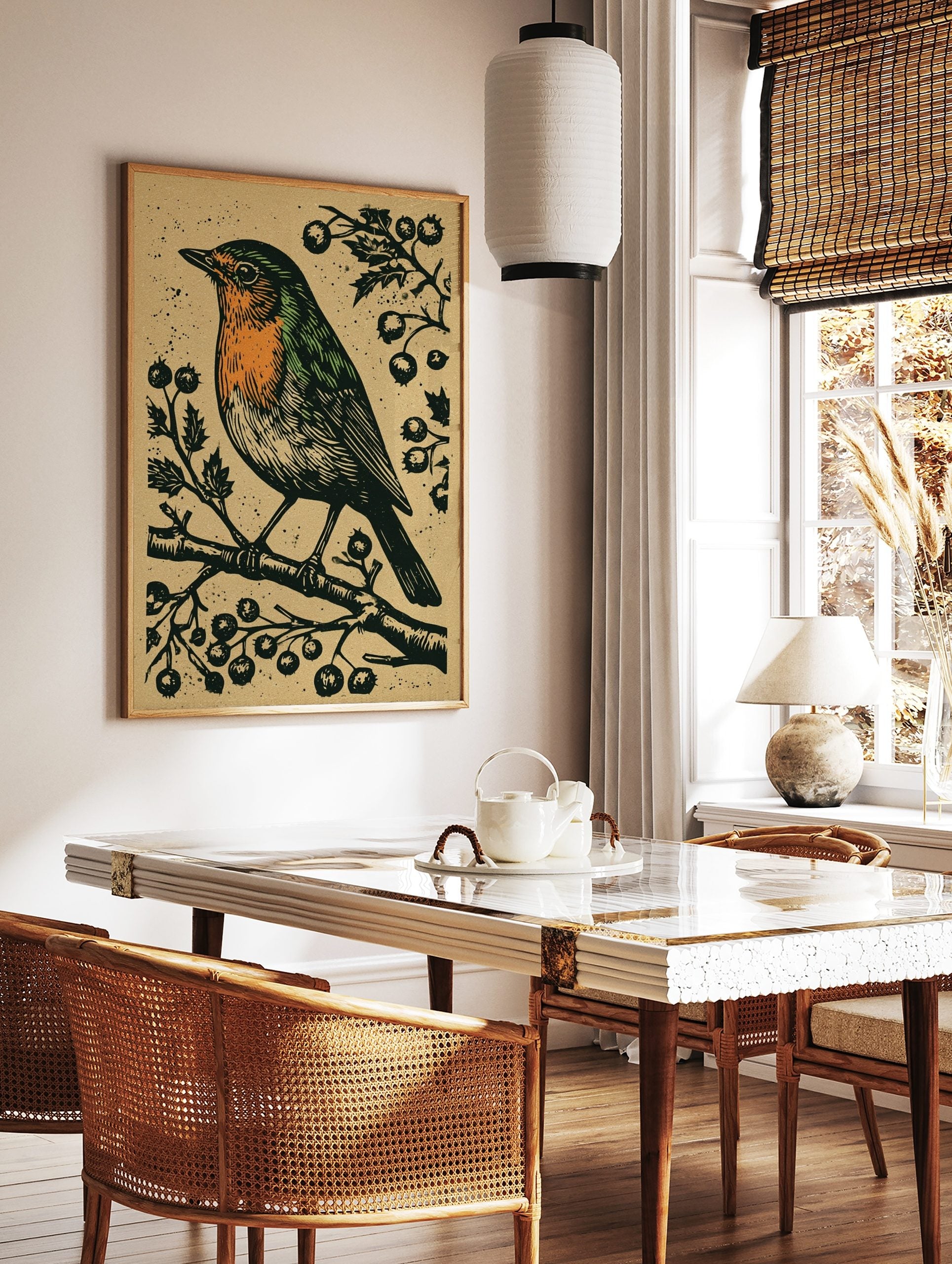 Linocut style art print of a robin bird with orange breast on a berry branch, textured beige, in a styled room mockup