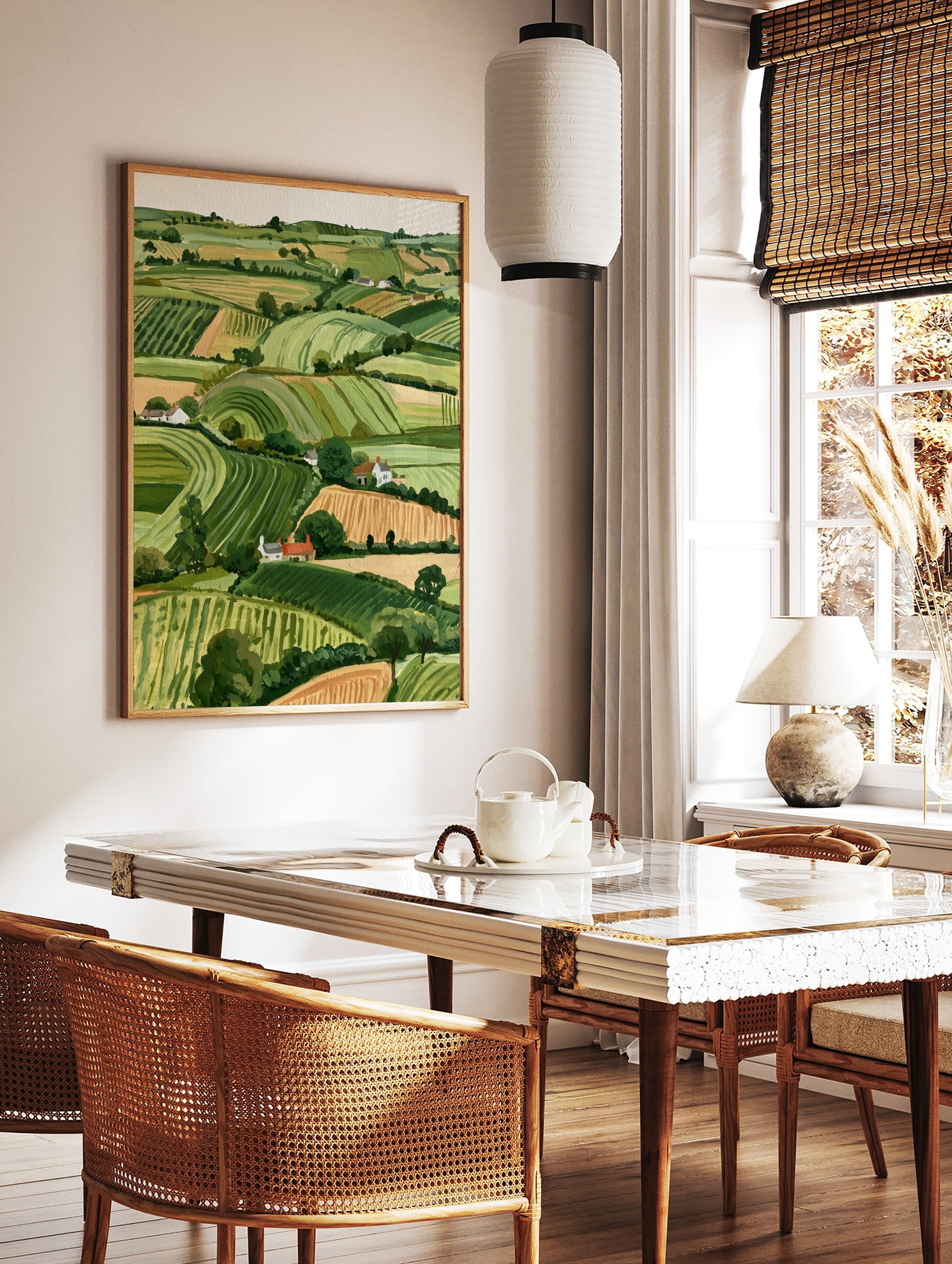 Rolling hills landscape with green fields and white cottages, illustrative countryside wall art, in a styled room mockup