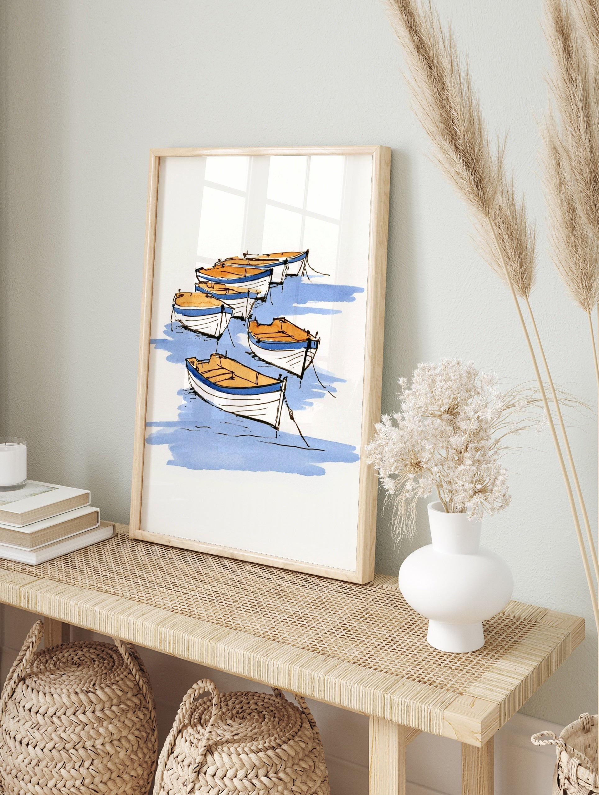 Sketch-style rowing boat illustration with blue water and tan boats on a white background, in an alternate framed mockup