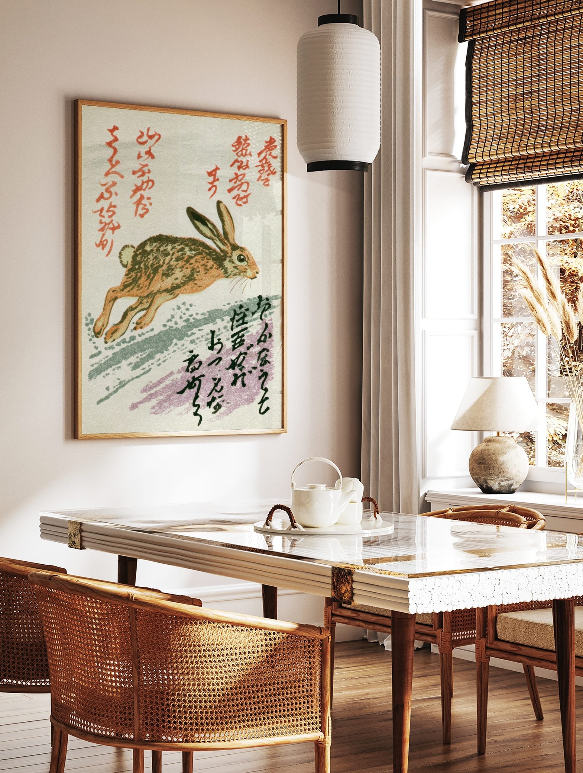 Running brown and tan hare illustration with red and black Japanese calligraphy on a white, in a styled room mockup