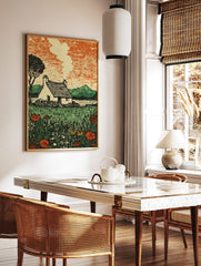 Illustrative print of a rural cottage with thatched roof, smoke, lake, mountains, and wildflower, in a styled room mockup