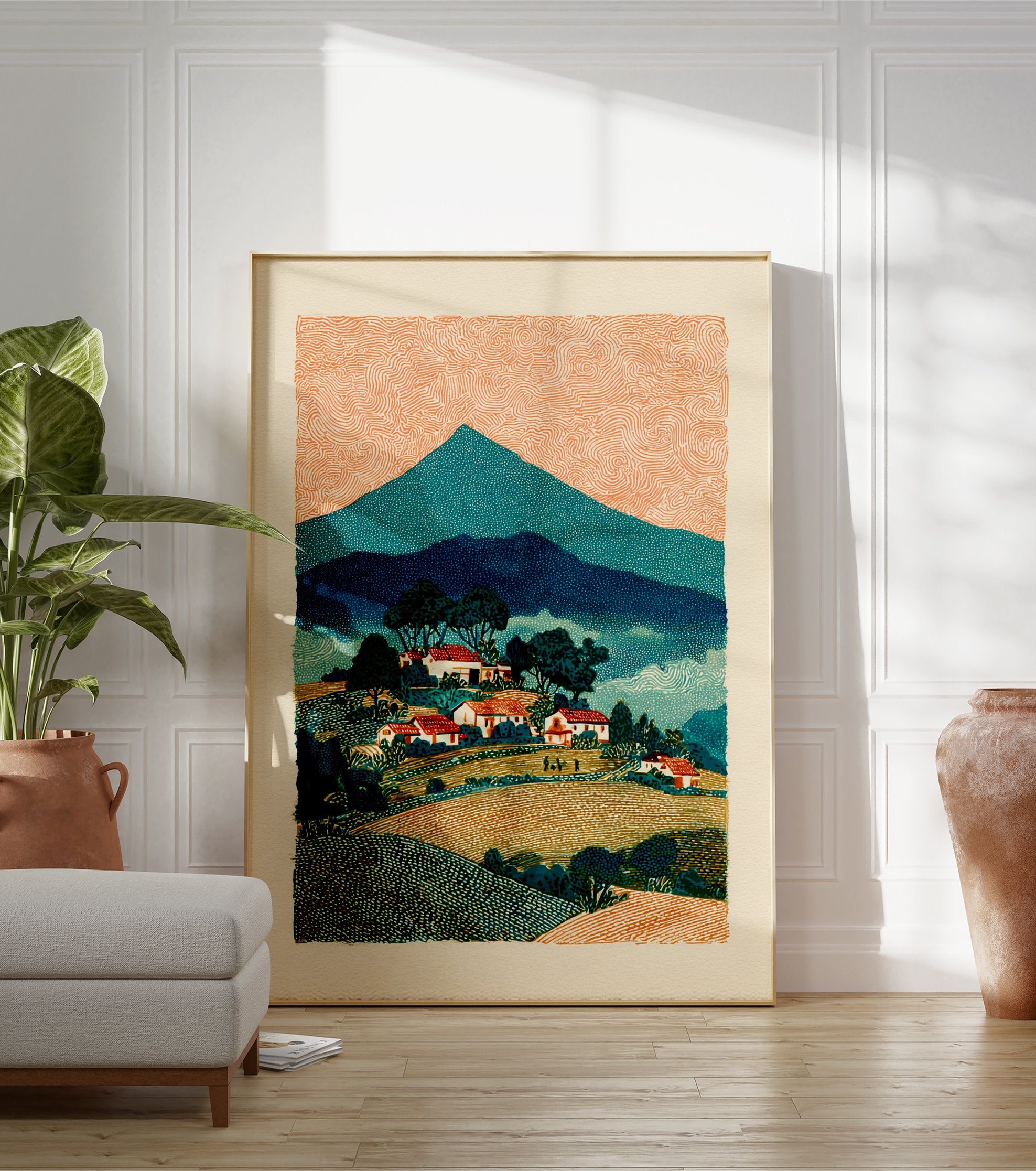 Rural landscape wall art depicting a mountain village with red-roofed houses, green trees, and an orange, swirling sky. - Image 3