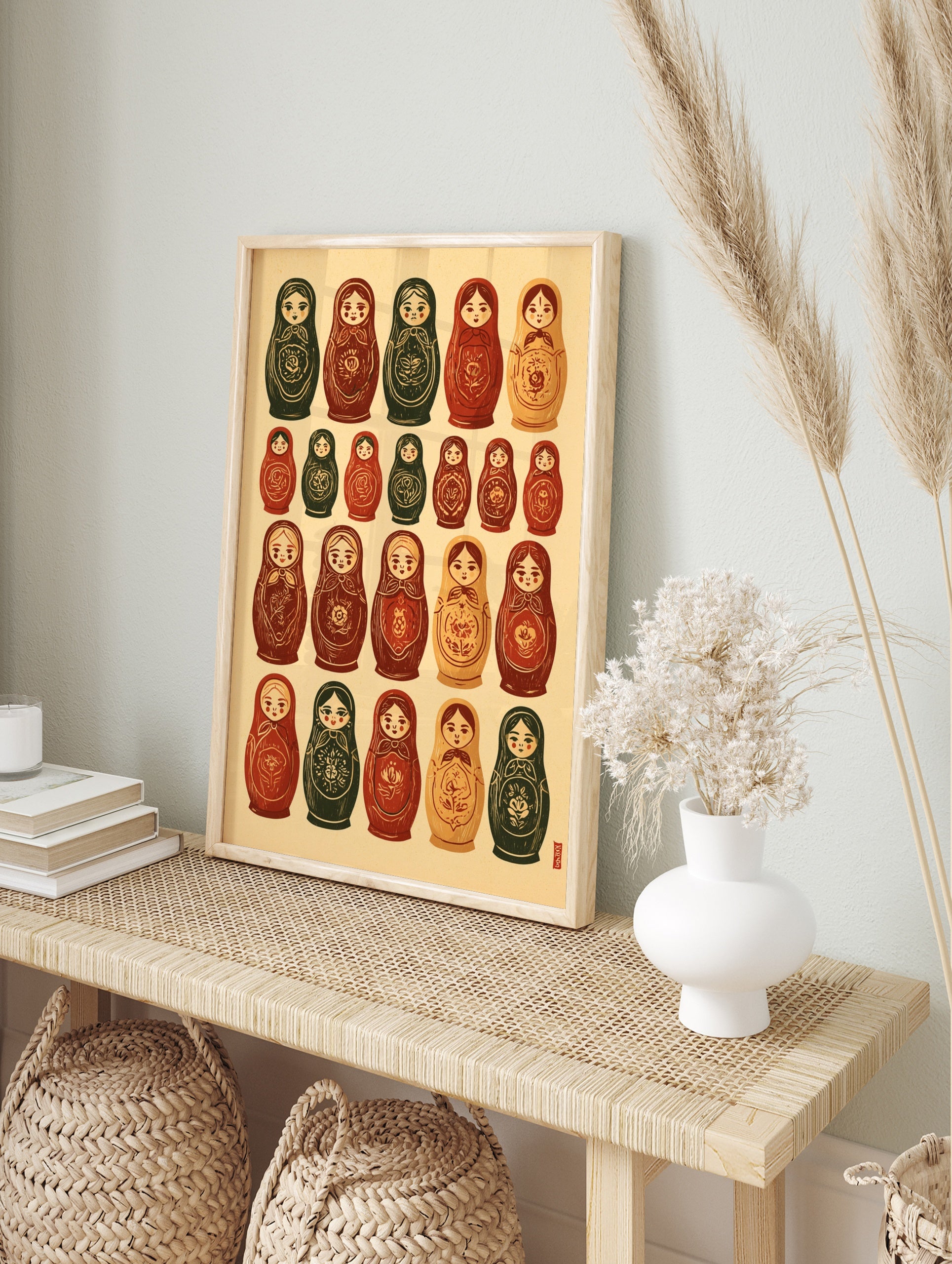 Grid of illustrated Russian nesting dolls with floral patterns in earthy red and green tones, in an alternate framed mockup