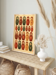 Grid of illustrated Russian nesting dolls with floral patterns in earthy red and green tones, in an alternate framed mockup