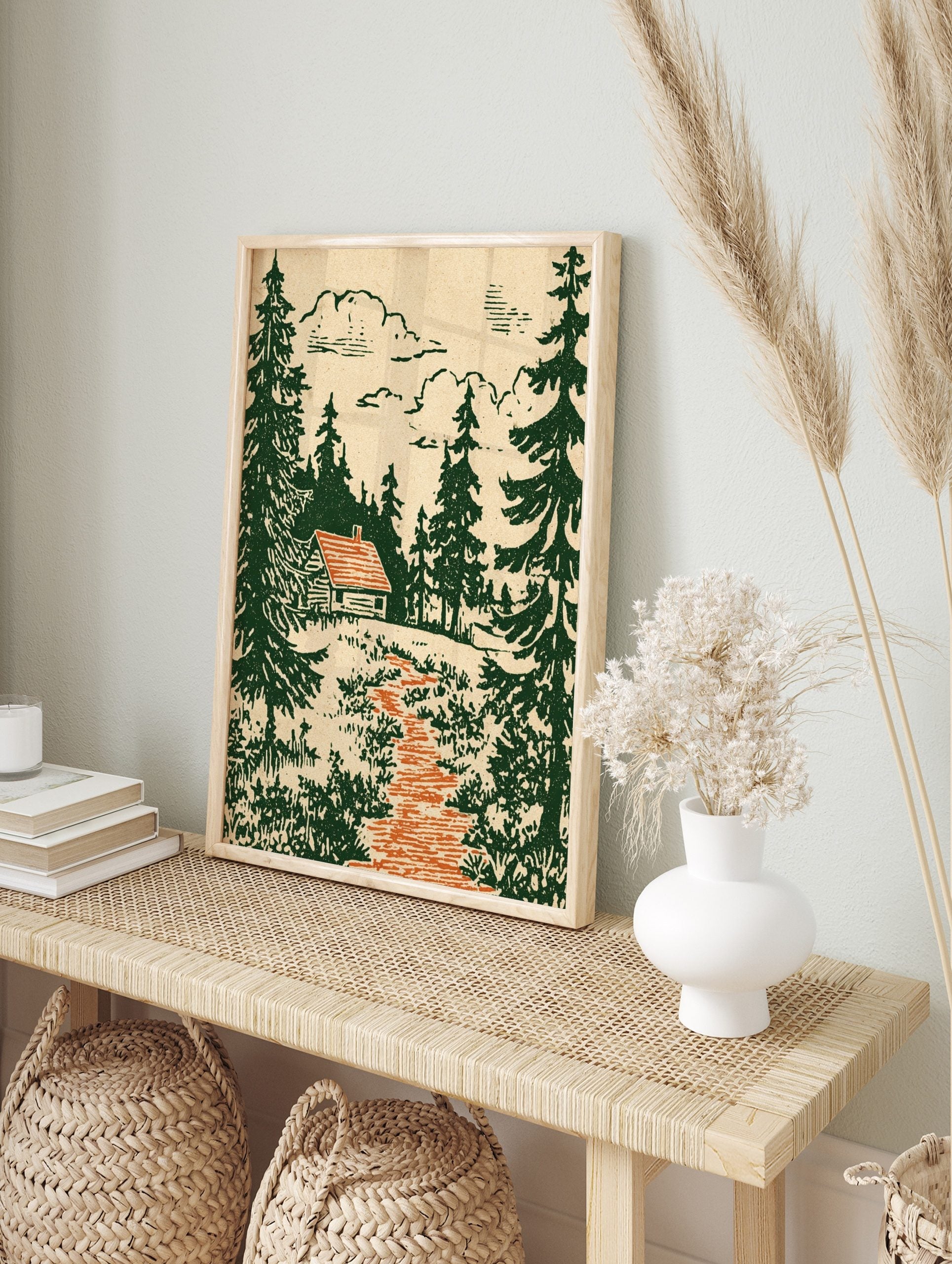 Rustic log cabin with orange roof in a dense dark green pine forest, with an orange path and, in an alternate framed mockup