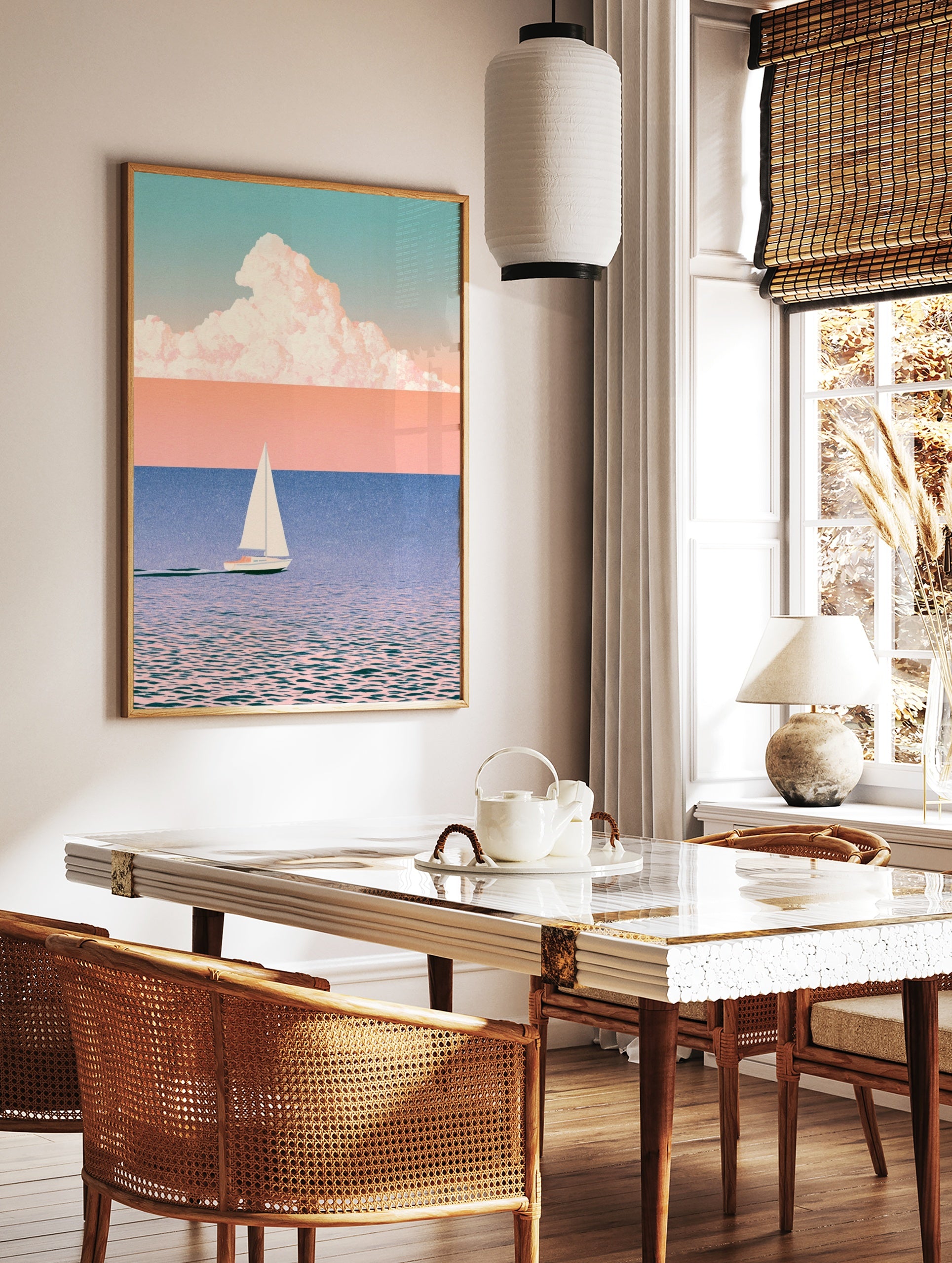 Minimalist sailboat wall art with soft pastel sky, blue water, and large cloud illustration on, in a styled room mockup