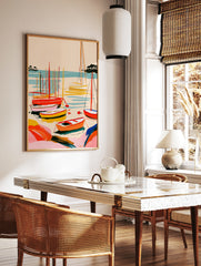 Abstract sailboat harbour wall art with vibrant red, orange, and yellow boats on blue water, in a styled room mockup