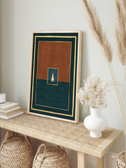 Minimalist art print of a white sailboat on dark water within a rust and teal geometric frame, in an alternate framed mockup