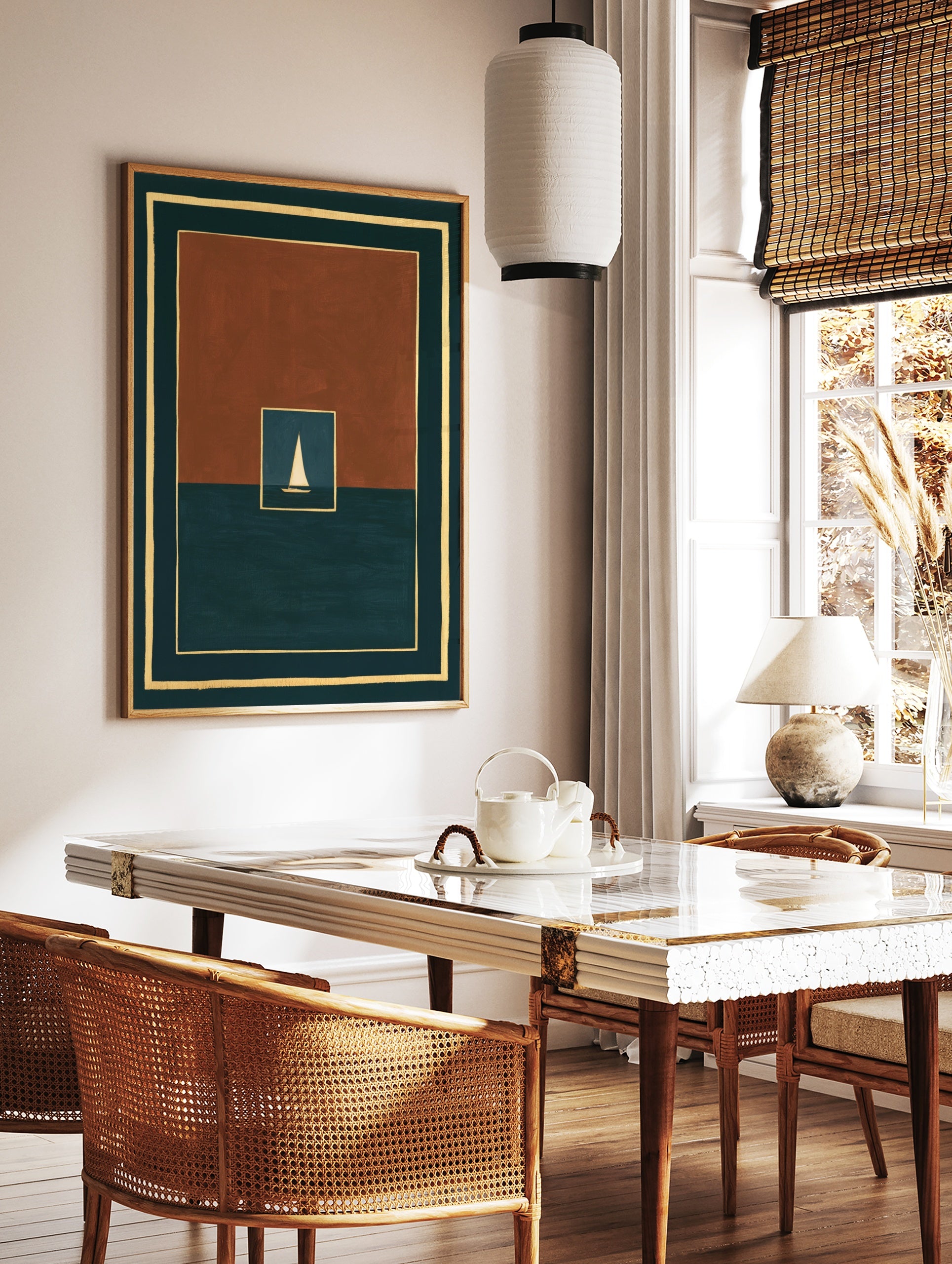 Minimalist art print of a white sailboat on dark water within a rust and teal geometric frame, in a styled room mockup