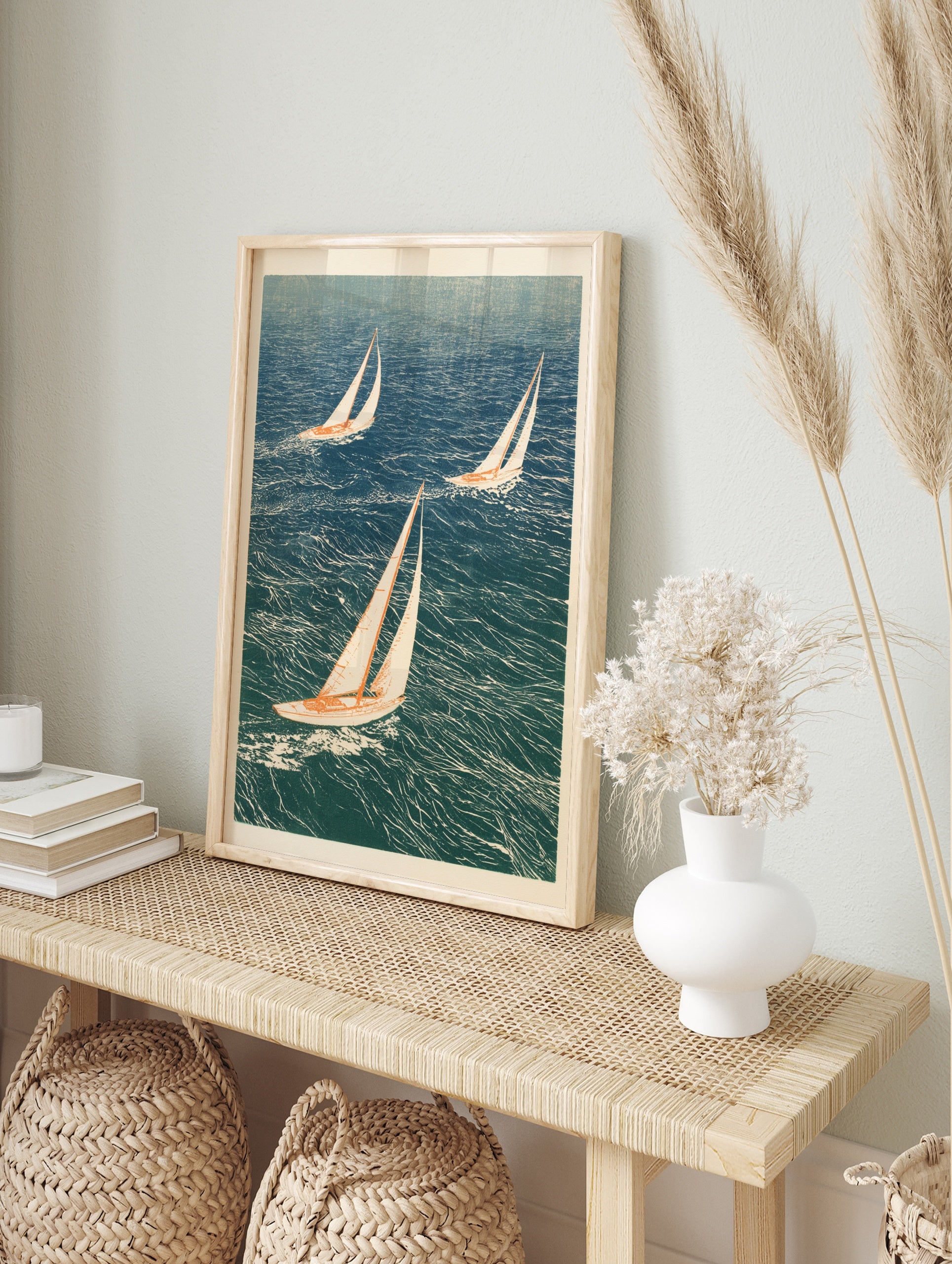 Illustrative art print of three sailboats sailing on choppy blue ocean water, in an alternate framed mockup
