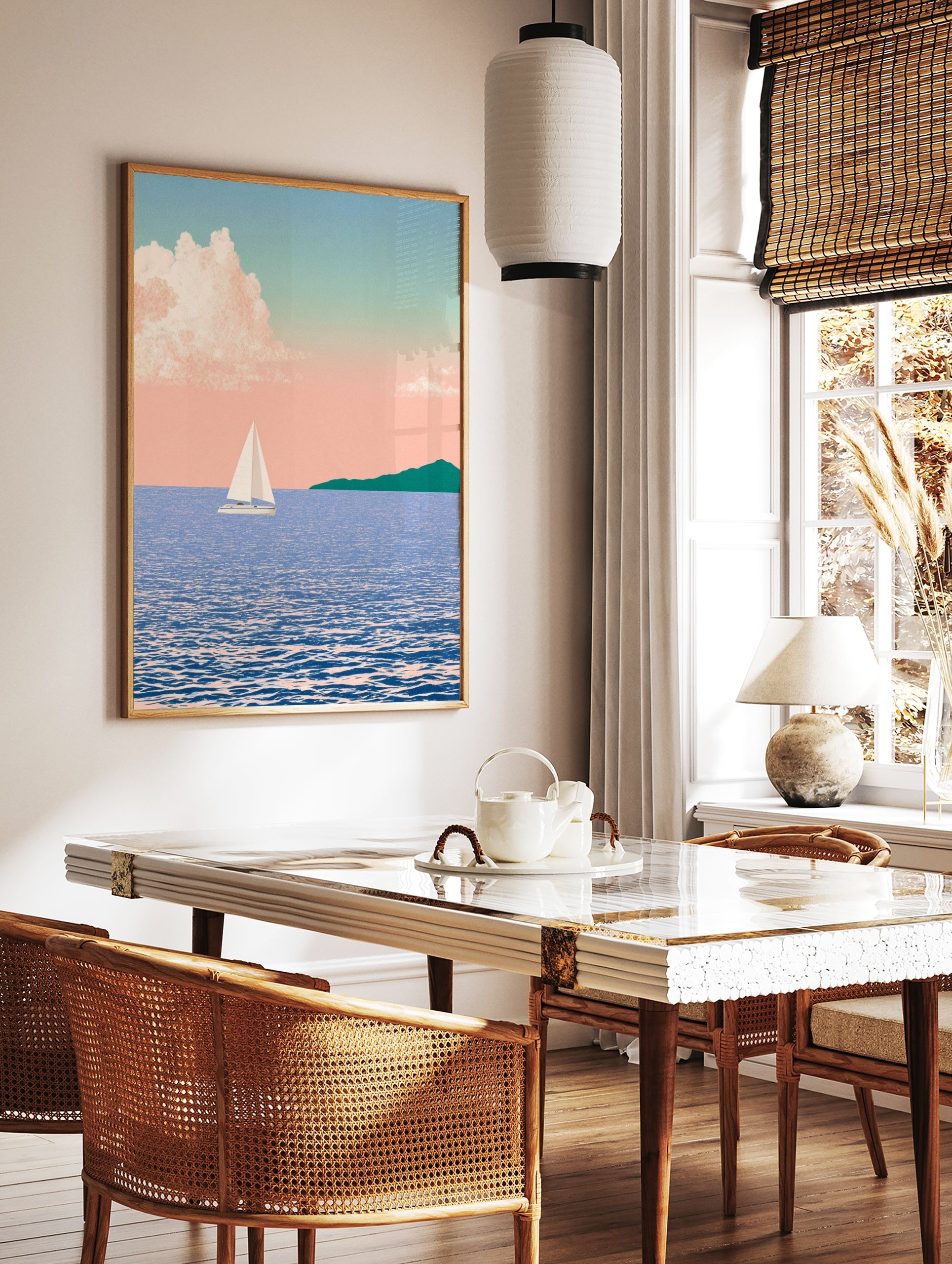 Illustration of a sailboat on blue water with a distant green headland under a soft pink pastel sky, in a styled room mockup