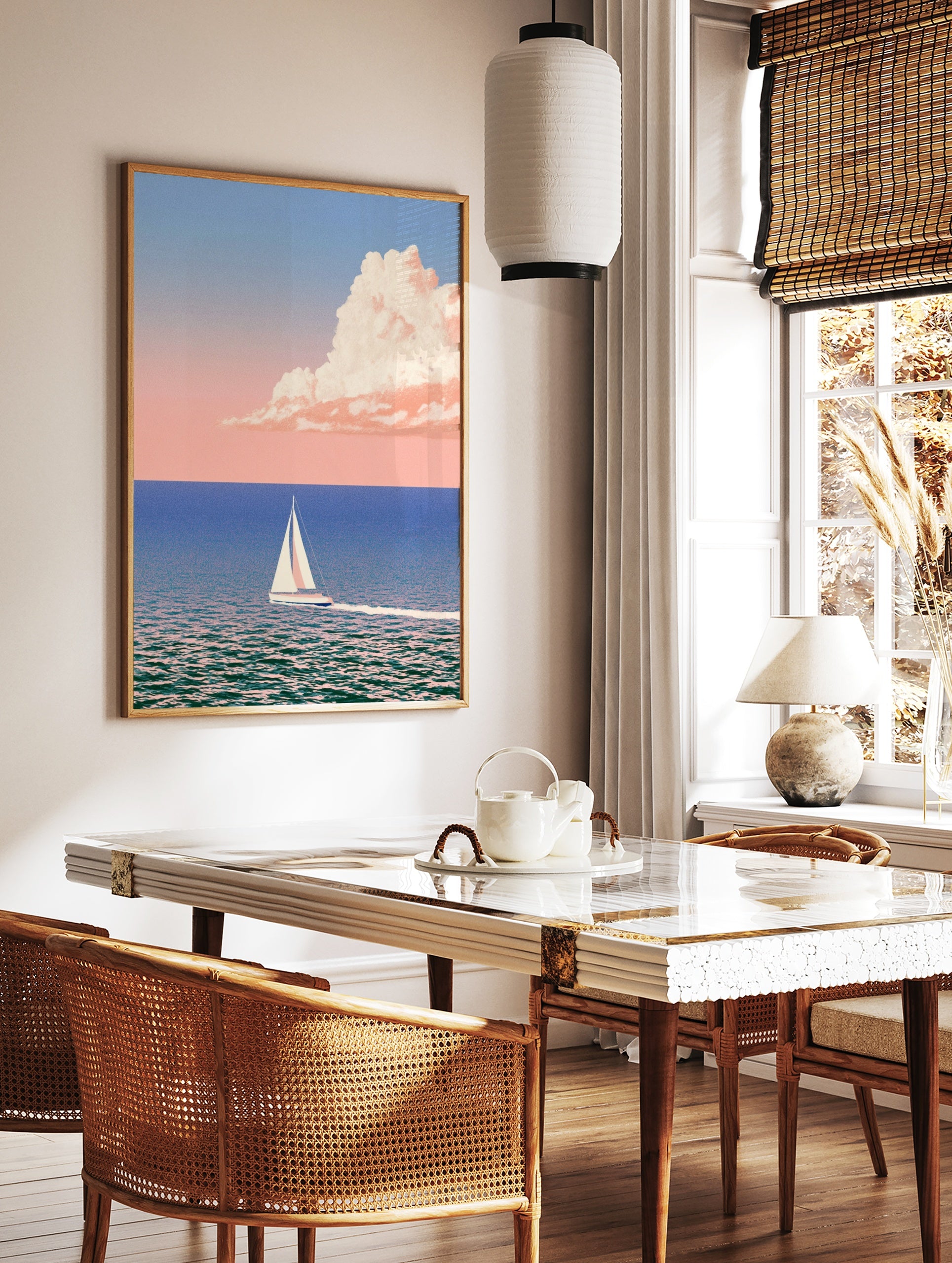 Minimalist sailboat art print on calm blue sea with pastel pink cloud in the sky, in a styled room mockup