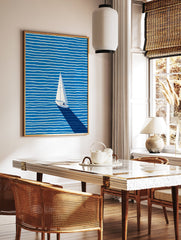 Minimalist sailboat wall art on a blue ocean with white wavy stripes and a long dark shadow, viewed from above. - Image 2
