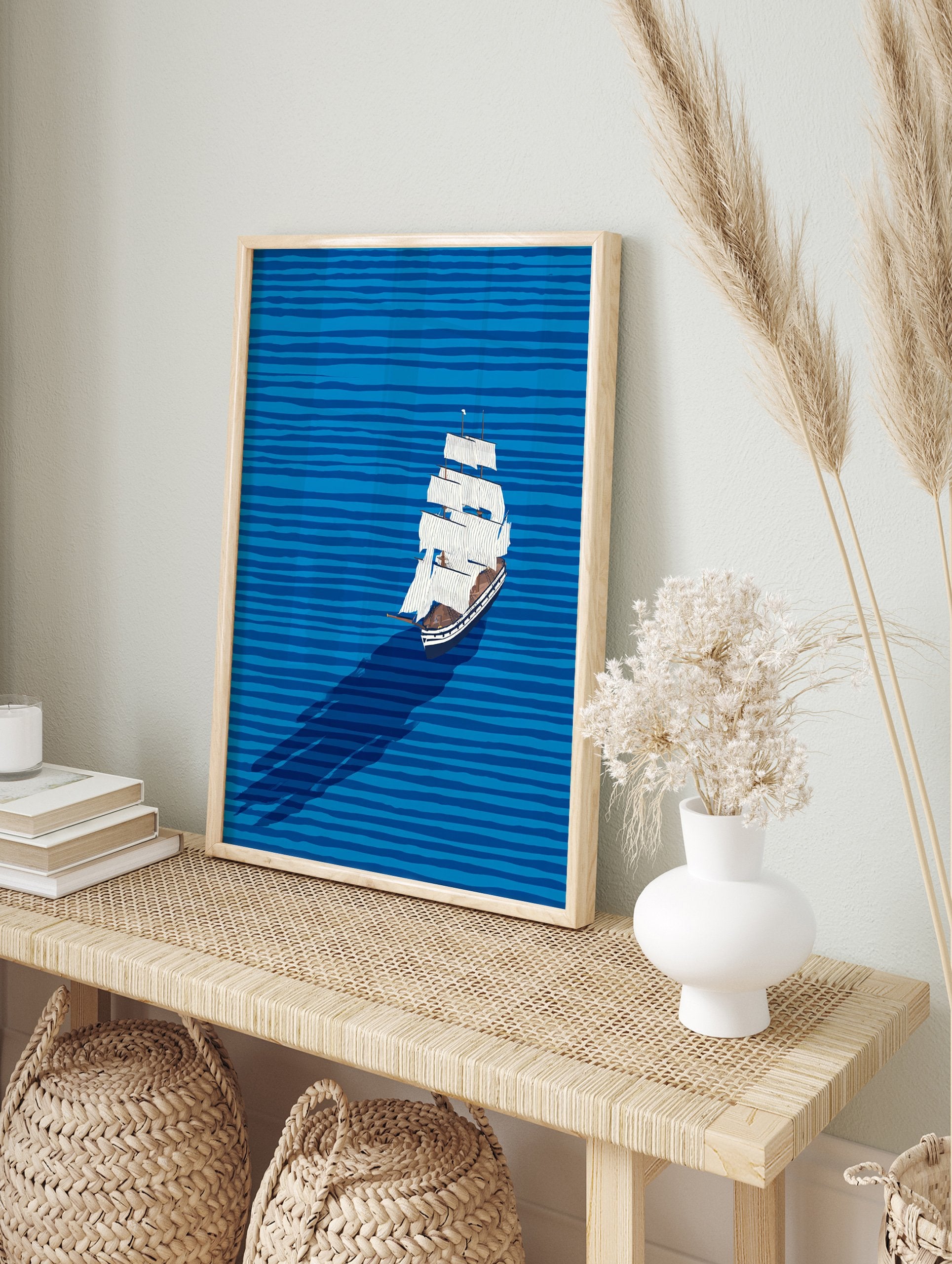 Illustrative sailboat wall art on a blue ocean with horizontal waves and a long shadow, featuring a white boat with brown accents. - Image 3