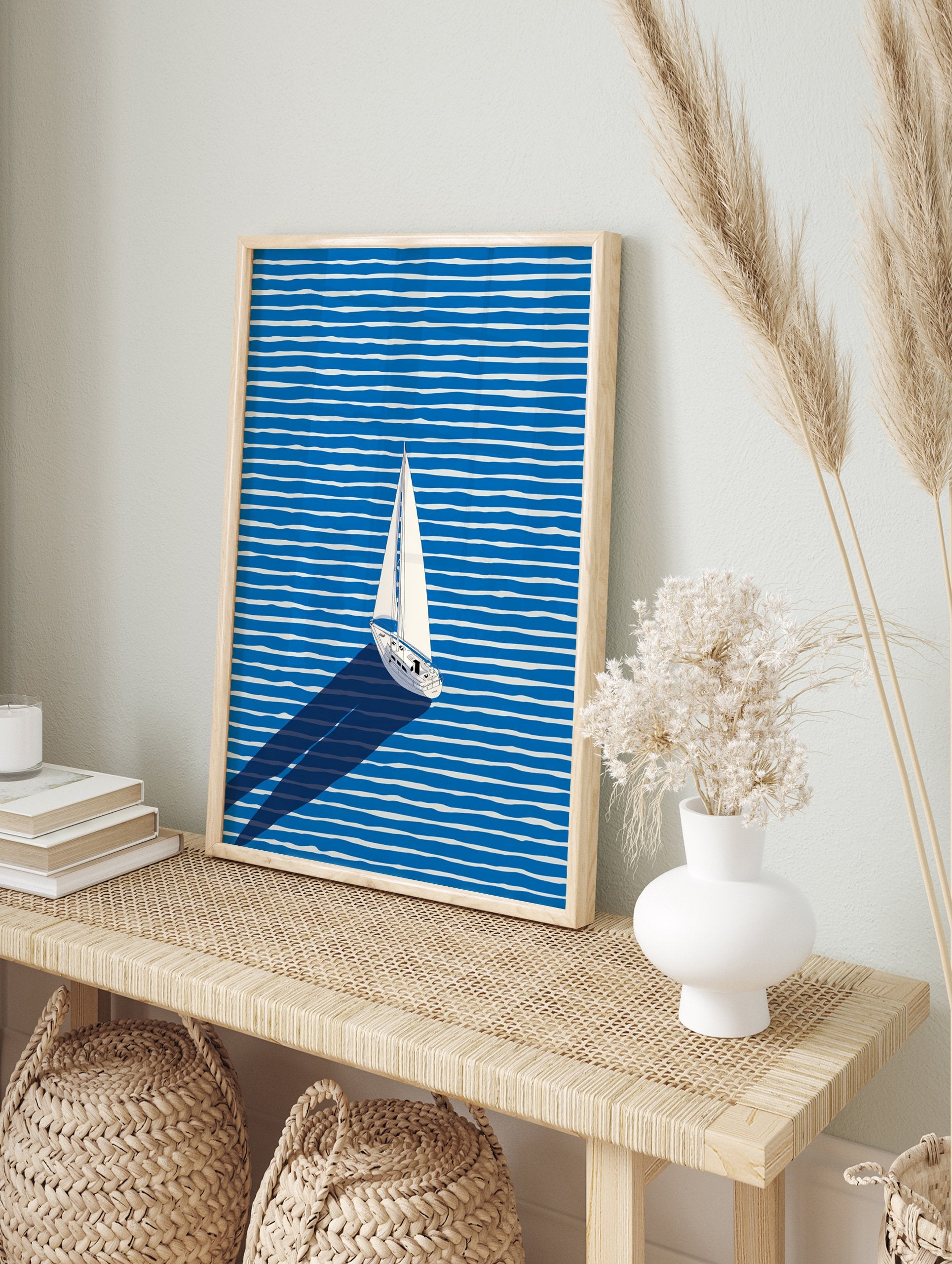 White sailboat with a long shadow sailing across a blue and white striped ocean in a modern illustration wall art. - Image 3