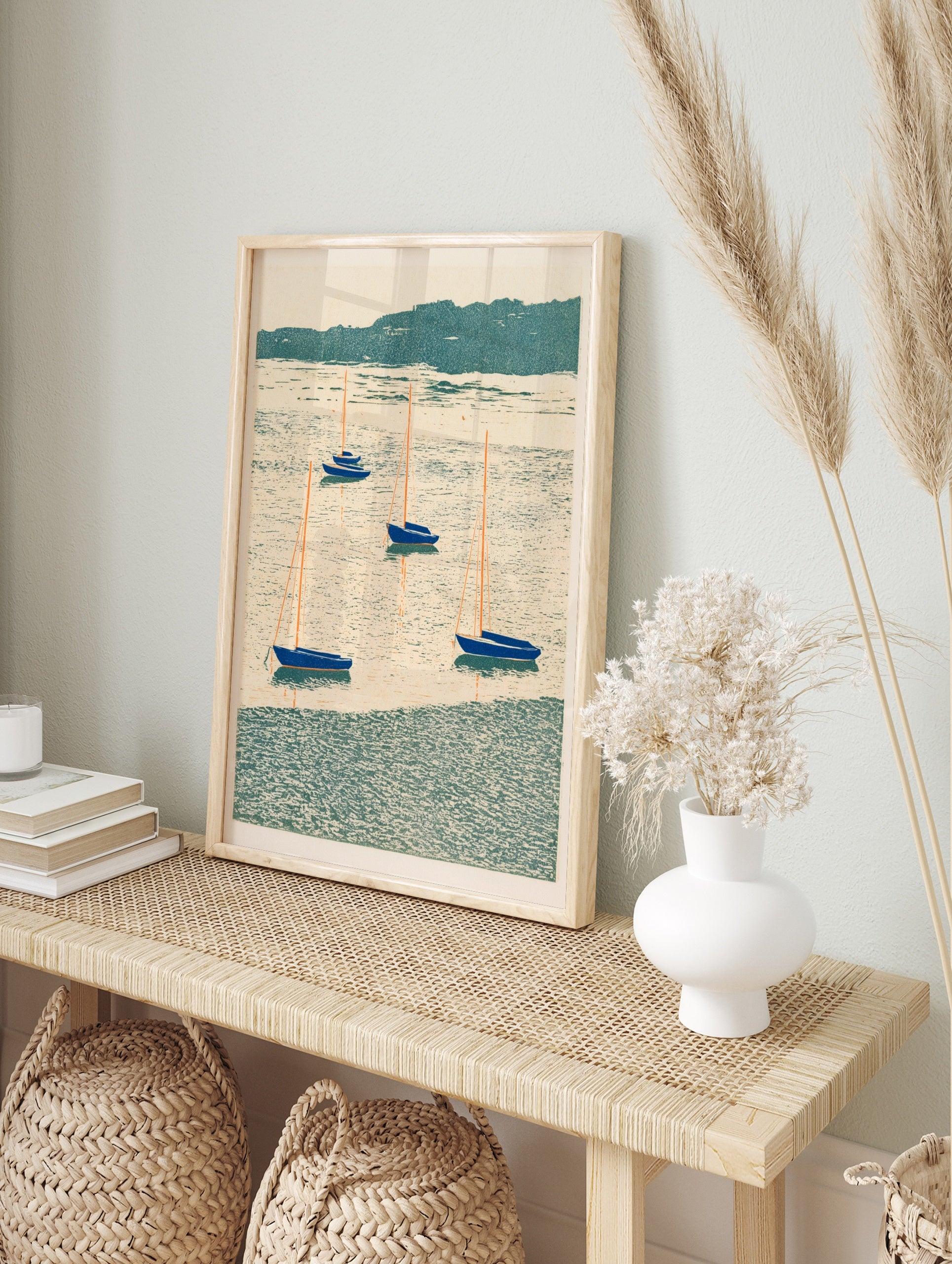 Illustration of five blue sailboats with orange masts on a textured teal sea, in an alternate framed mockup