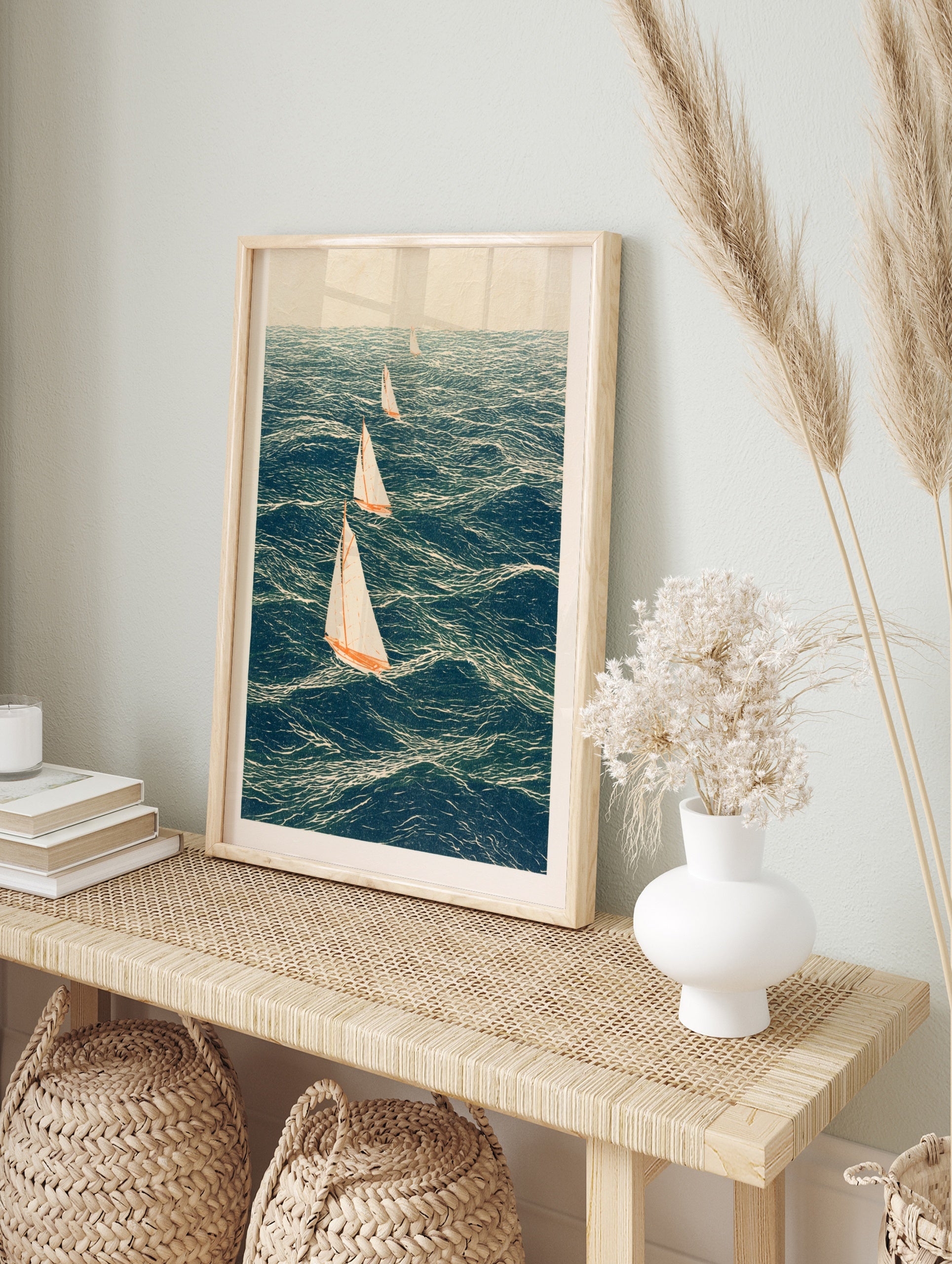 Four sailing boats with white sails and orange hulls on a deep blue sea in an illustrative, in an alternate framed mockup