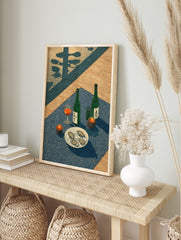 Japanese woodblock style print of two sake bottles, oysters on ice, a drink, and candles on a, in an alternate framed mockup