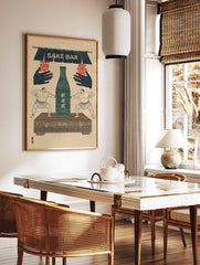 Vintage Japanese sake bar print with two sumo wrestlers, green sake bottle, and "SAKE BAR" sign, in a styled room mockup