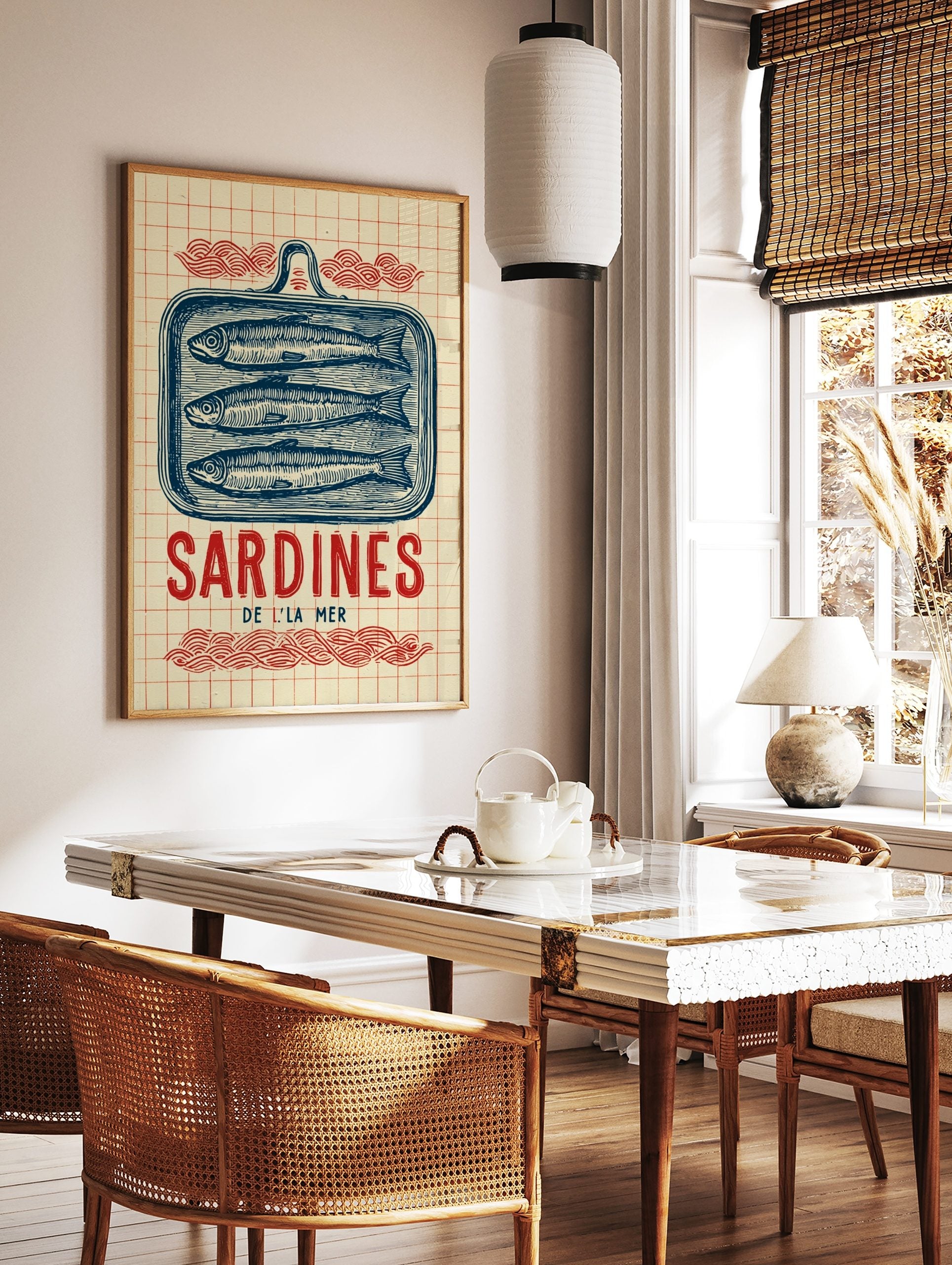Vintage illustrative print of three blue sardines in a tin, with 'Sardines De L'La Mer' text and, in a styled room mockup