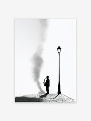 Black and white saxophone wall art featuring a silhouetted jazz musician playing under a lamppost on a cobblestone street.
