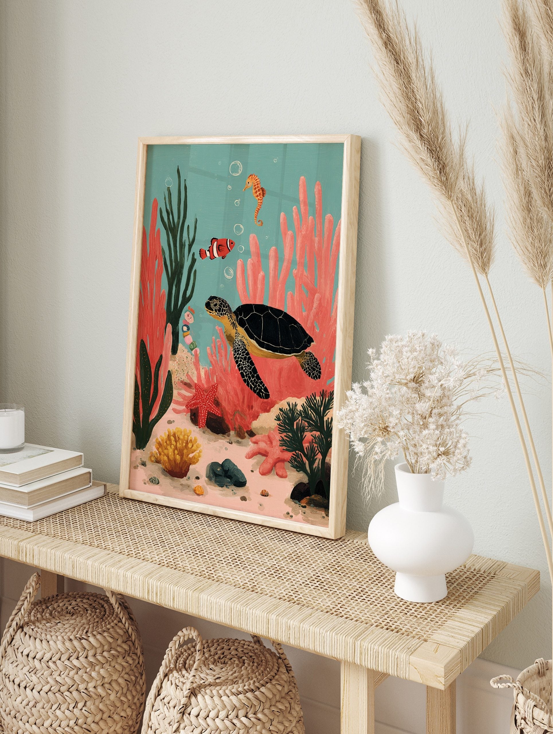 Colourful illustrative print of a sea turtle, clownfish, and seahorse in a vibrant coral reef, in an alternate framed mockup
