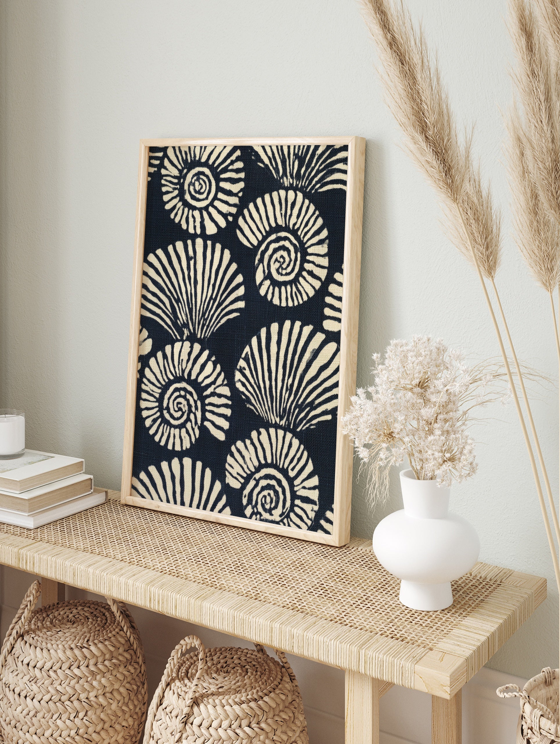 Stylised navy and cream ammonite seashell pattern illustration, repeating spiral shells, in an alternate framed mockup