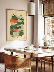 Stylised flock of sheep in green, orange, and cream colours, graphic linocut-inspired art print on, in a styled room mockup