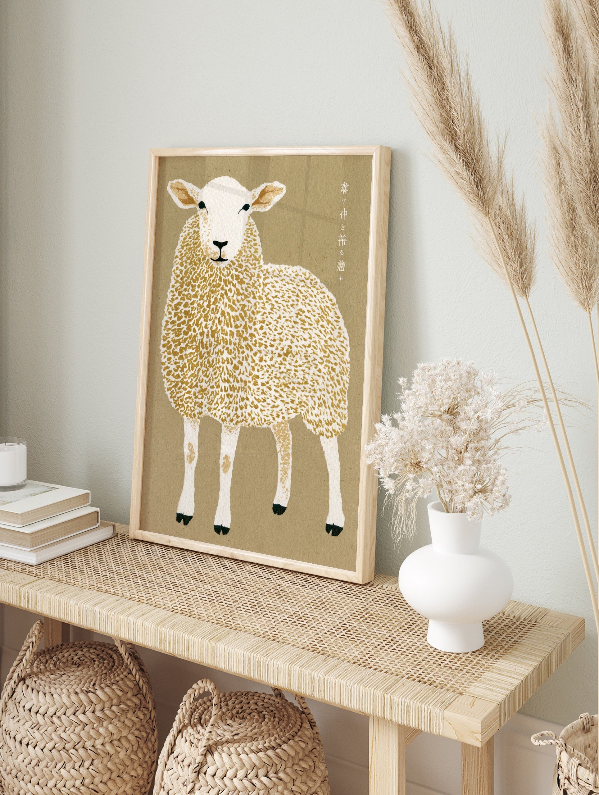 Illustrative sheep wall art with Japanese typography on a tan background, in an alternate framed mockup