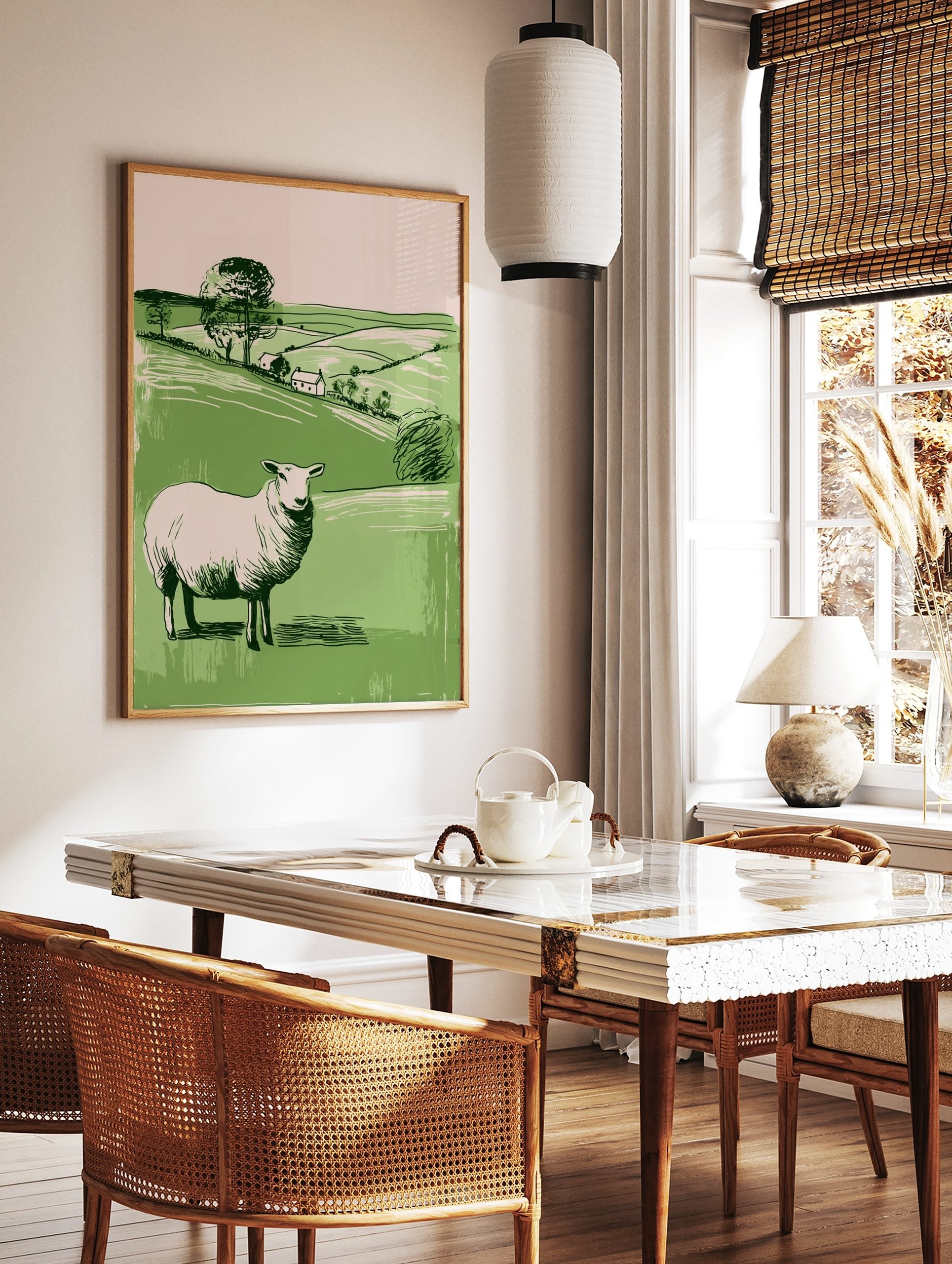 Illustrative white sheep in green pastoral landscape with hills, trees, and two cottages, portrait, in a styled room mockup