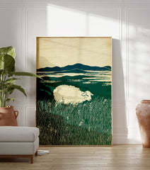 Art print of a white sheep grazing in a lush green field with distant blue mountains under a cream sky, in a woodcut style. - Image 3