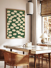 Illustrative sheep pattern art print with cream-coloured sheep on a solid dark green background, in a styled room mockup